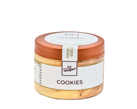 Ein Glas Hofmanns Shop Premium-Eis Cookies mit braunem Deckel, weißem Etikett und knusprigen Stückchen im Inneren.