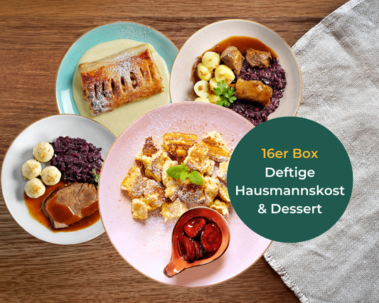 Vier Teller mit herzhafter deutscher Küche aus Hofmanns Hausmannskost-Box + Dessert-Box auf einem Holztisch.