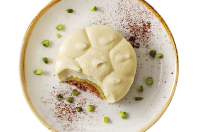 Hofmanns Shop Tiramisu Pistazie: runde Nachspeise mit Mascarponecreme und grünen Pistazien.