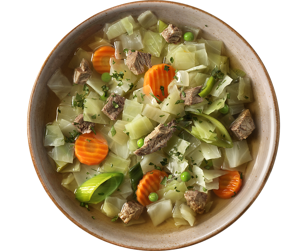 Eine Schüssel Pichelsteiner Eintopf mit Karotten, Weißkohl, Erbsen und Kräutern von Hofmanns Shop.