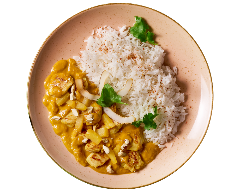 Kokoshuhn von Hofmanns Shop: Basmati-Reis, gelbe Curry-Kokossoße, Hähnchenbrust, Kokosstücke.