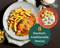 HOFMANNs Hausmannskost-Box: Teller mit Pommes, Schnitzel, Pilzsauce, Kartoffeln, Sauerbraten & Bier.