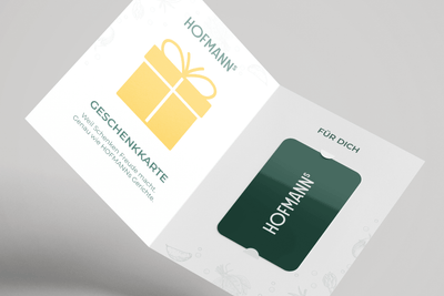 Weiße Karte mit gelbem Geschenkicon und „HOFMANNs“ auf beiden Seiten, HOFMANNs Essensschecks (machfit).