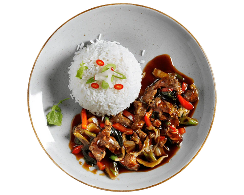 Ein Teller Teriyaki-Rinde von Hofmanns Shop mit Reis, gebratenem Gemüse, Chili und Kräutern.